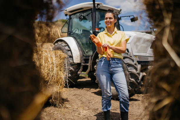 istock Women farmer and tractor 2163004429
