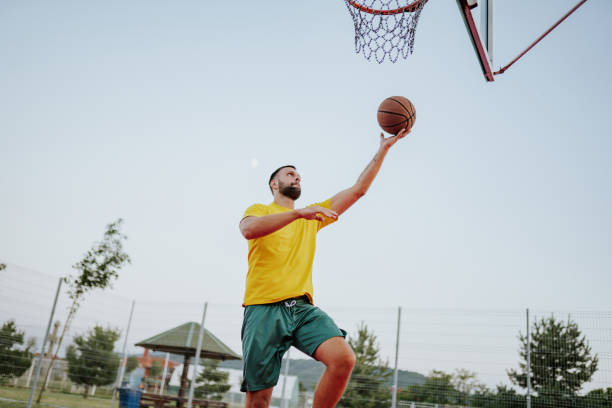 istock Playing basketball in the park 2163006105