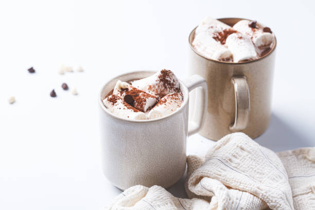 istock Winter hot chocolate with marshmallows in mug on white background. Christmas drink concept. 2163011030