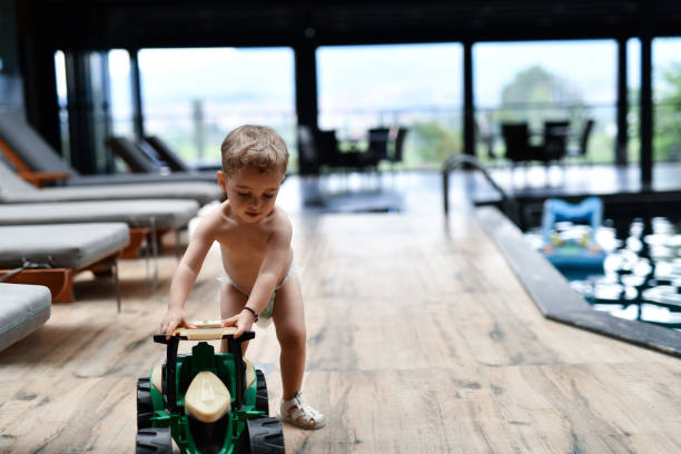 Little boy having fun in toy car.
