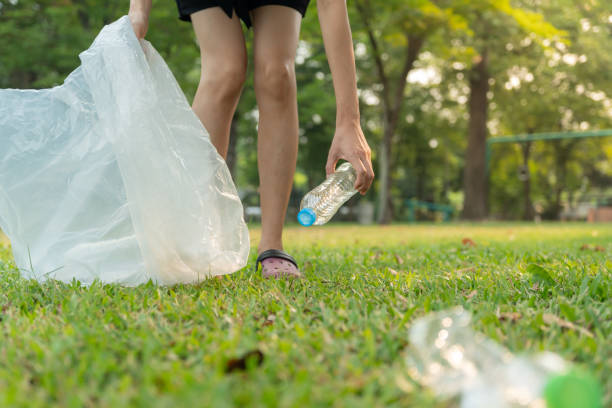 istock Save earth. Volunteer pick up trash garbage at the park and plastic bottles are difficult decompose prevent harm. Earth, Environment, Greening planet, reduce global warming, Save world ,pollution 2163012331