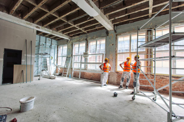 istock Team in conversation during building renovation with gear on 2163013697