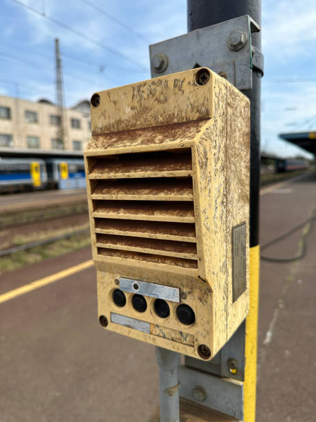 Old dirty intercom at the railway station platform