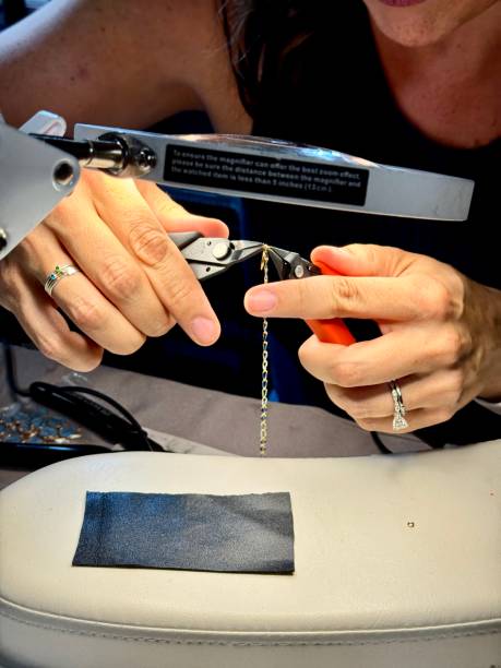 istock A jewelry designer uses tools to make jewelry 2163016034