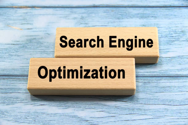 istock search engine optimization wording  or text on wood block with blue background.Copy space and business concept. 2163017235