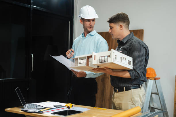 istock Architect caucasian man working, blueprint meeting for project working with partner on model building at company office. 2163019114