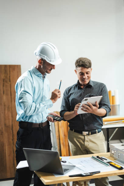istock Architect caucasian man working, blueprint meeting for project working with partner on model building at company office. 2163019125
