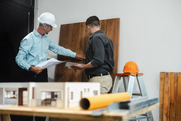 istock Architect caucasian man working, blueprint meeting for project working with partner on model building at company office. 2163019127