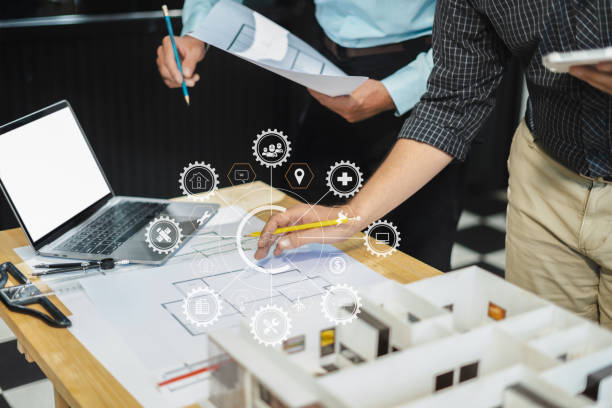 istock Architect caucasian man working, blueprint meeting for project working with partner on model building at company office. 2163019134