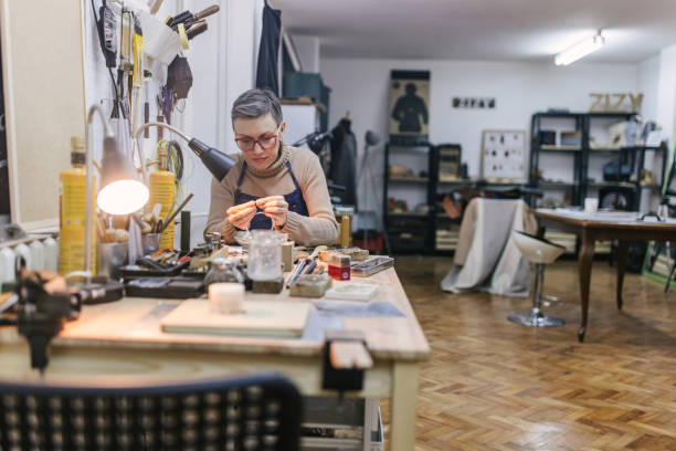 istock Jeweller working with tools in a well-organized workshop 2163019141
