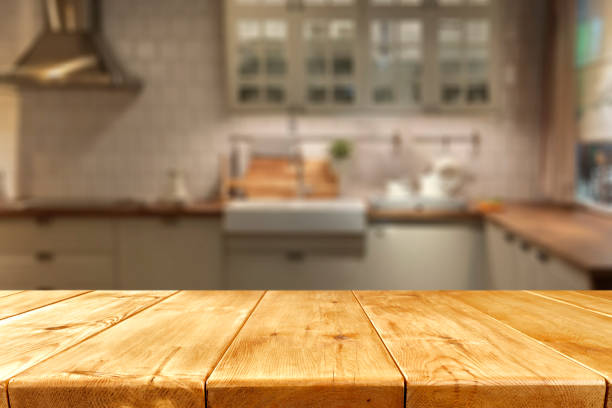 istock Empty wooden table with copy space for products. Blurred bright kitchen interior background. 2163020537