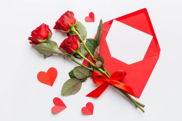 istock Valentine day composition with Envelope, rose flower and Red heart on table. Top view, flat lay. Holiday concept 2163023514