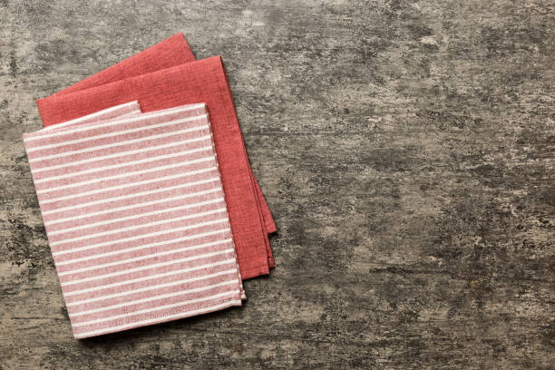 istock top view with red empty kitchen napkin isolated on table background. Folded cloth for mockup with copy space, Flat lay. Minimal style 2163023606