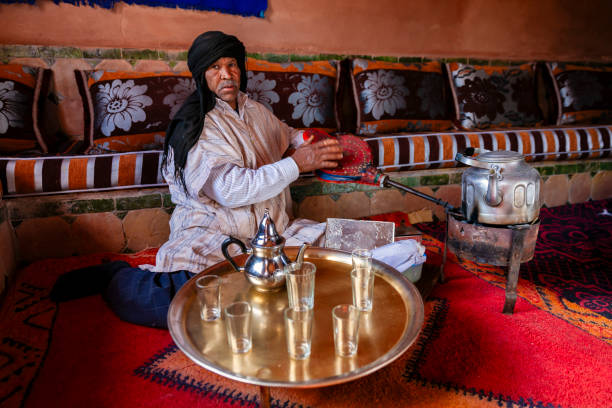 istock Moroccan man preparing Maghrebi mint tea. 2163025083