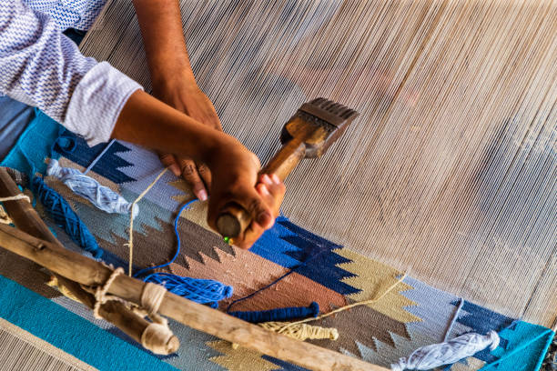 istock Indian man weaving textiles (durry) in Rajasthan 2163025442