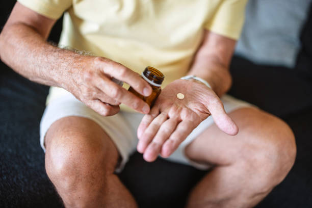 istock Caucasian Senior Man Taking Medication 2163025443