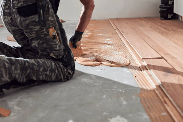 istock Professional handyman installing laminate flooring in a new apartment. 2163026601
