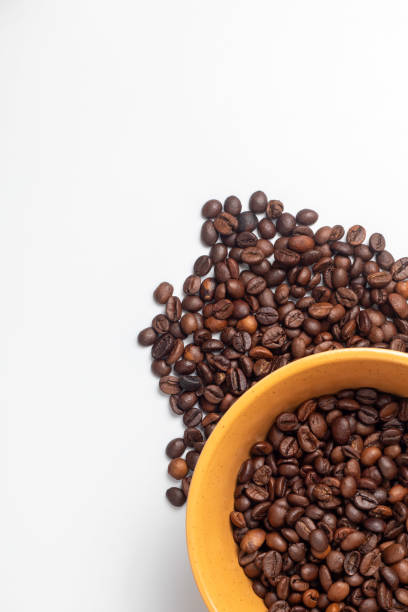 istock Yellow breakfast bowl filled with coffee beans 2163026965