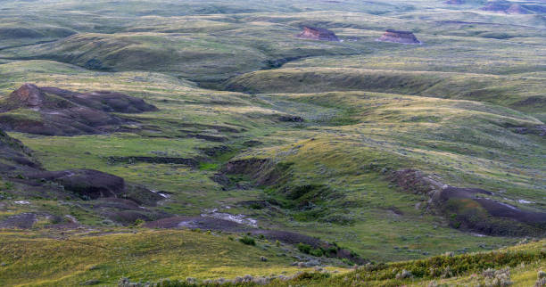 istock Sun Setting over Hills in the Valley of 1000 Devils 2163028363