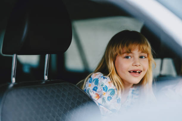 istock Happy Child in Car on First Day Back to School 2163029247