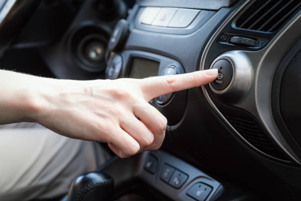 istock Driver presses his finger on the button the windshield heating 2163031747