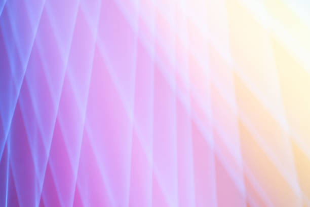 A dreamy pink and yellow background overlaid with a diamond pattern