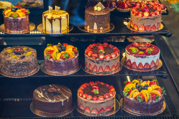 Freshly Baked Cakes Displayed in a Bakery Showcase closeup