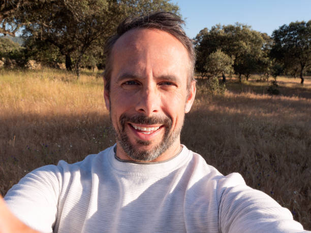 Man Taking Selfie in Sunny Countryside Landscape