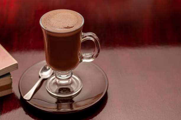 istock Cup of hot chocolate on a wooden table. 2163040905
