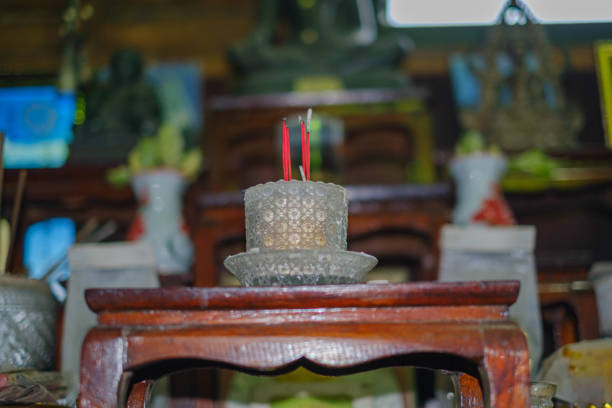 Close up incense sticks burning in temple