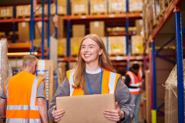 happy young warehouse worker stock photo
