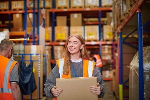 happy young warehouse worker stock photo