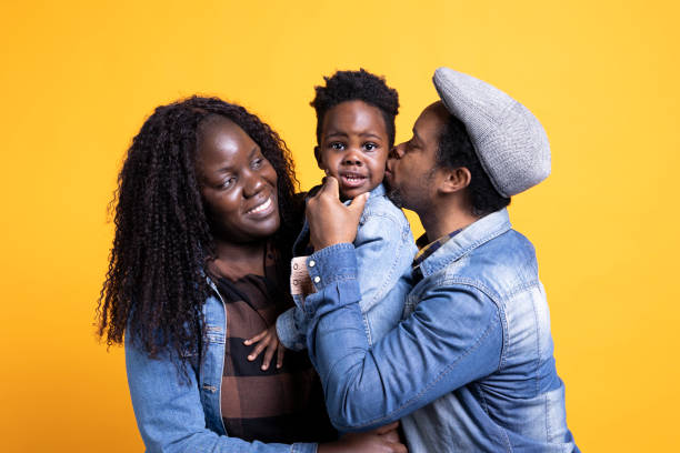 istock Affectionate father kissing his little son on the cheek 2163044088