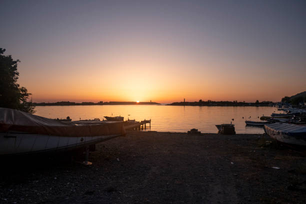 Free picture: Sunset over a lake harbor with silhouettes of small motor ...