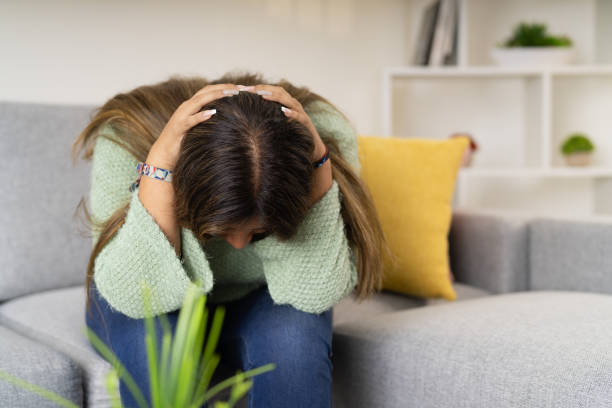 istock Desperate woman looking down on the sofa 2163045569