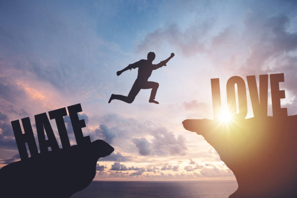 istock Silhouette of a man jumping from cliff to cliff 2163048606