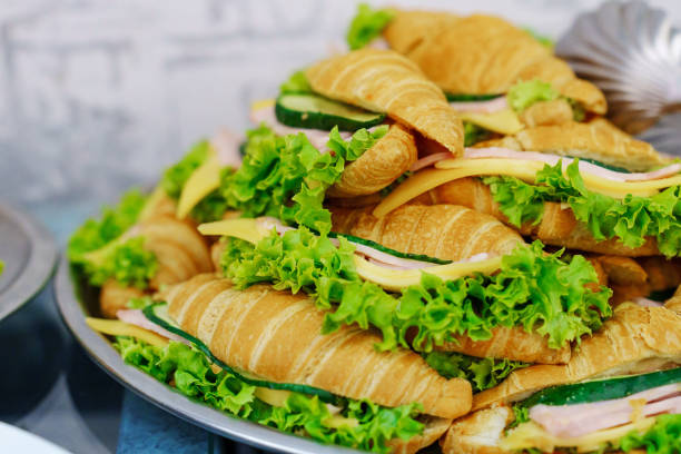 istock croissants with ham, cheese and lettuce. 2163049770