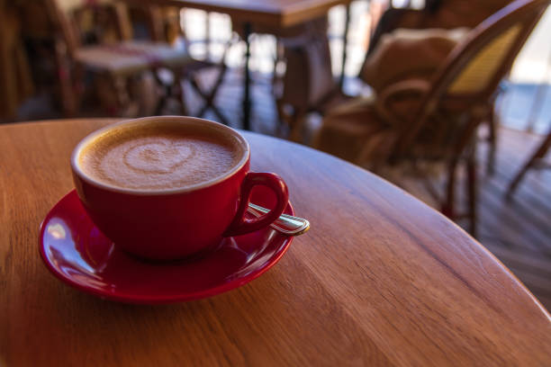 istock Red cup with cappuccino in sidewalk cafe 2163050899