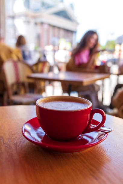 istock Red cup with cappuccino in sidewalk cafe 2163050914