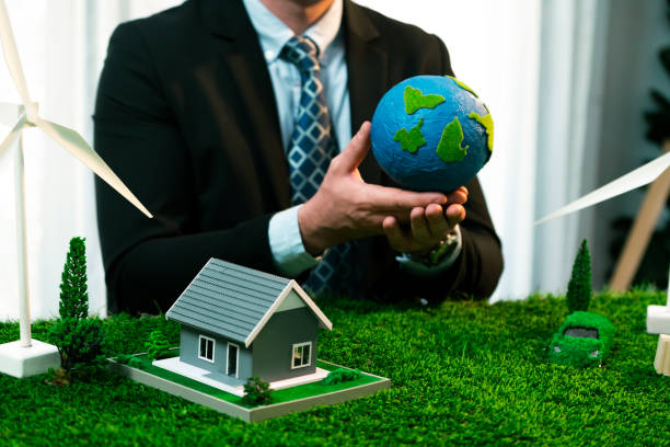 istock Businessman or CEO holding paper globe in office. Quaint 2163051961