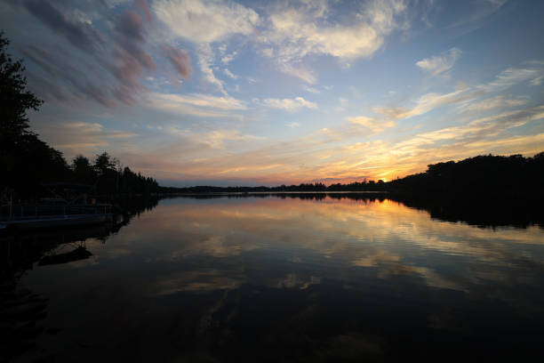 The sun sets over Mariaville Lake in Delanson, New York.