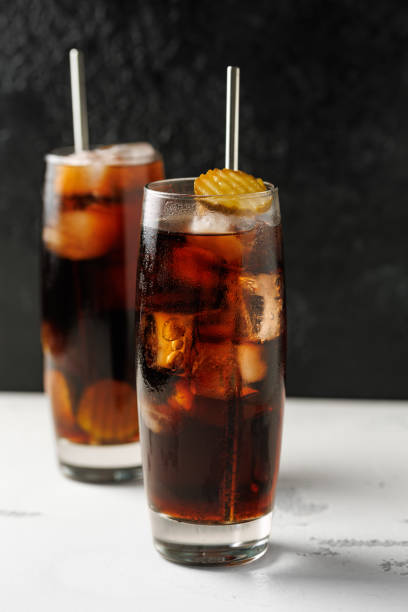 istock Soft drink cola with pickles and ice in a glass. 2163052800
