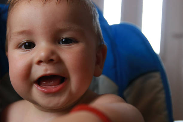 portrait first tooth growing baby happy smiling positive emotions