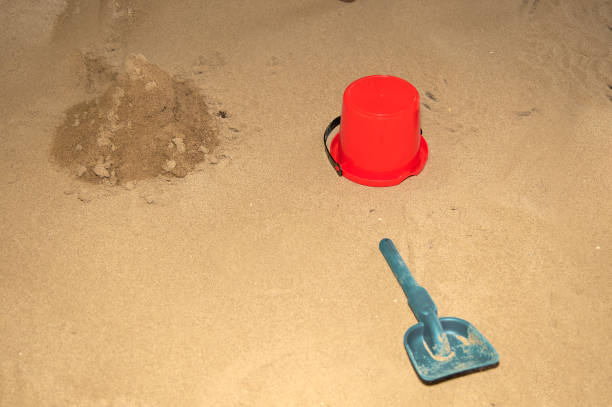 Toys On Sand At Beach Against Sky