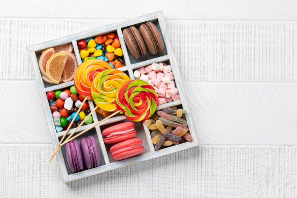 istock Various colorful candies, lollipops, and macaroons 2163056257