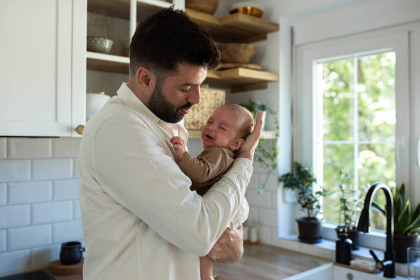 istock The father soothes the baby 2163056497