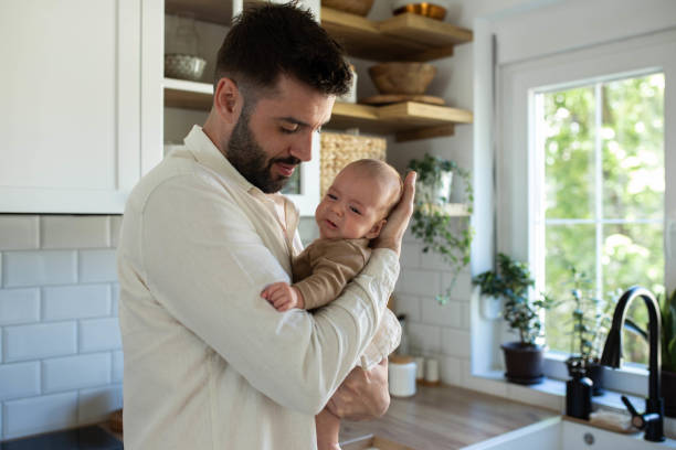 istock The father soothes the baby 2163056503