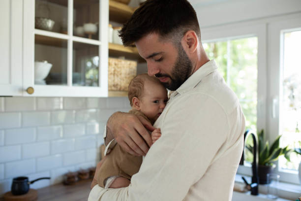 istock The father soothes the baby 2163056533
