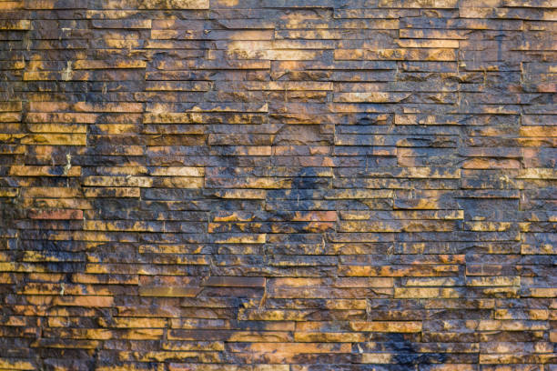 Brick wall background is a wall made of clay bricks, giving the structure strength and cement line between bricks that looks beautiful. It is popular to build a wall of ancient monuments.copy space,