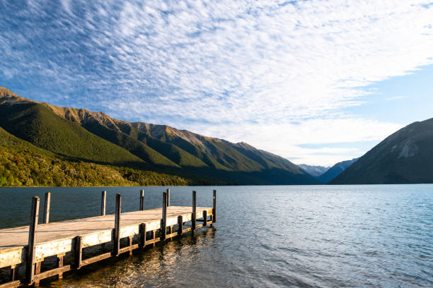 istock Tranquil Mountain Lake with Wooden Dock 2163057201